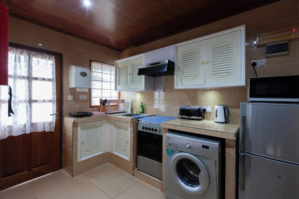 Deluxe Villa, 1 Bedroom, Sea View | Private kitchen | Coffee/tea maker, full-size fridge, microwave, stovetop