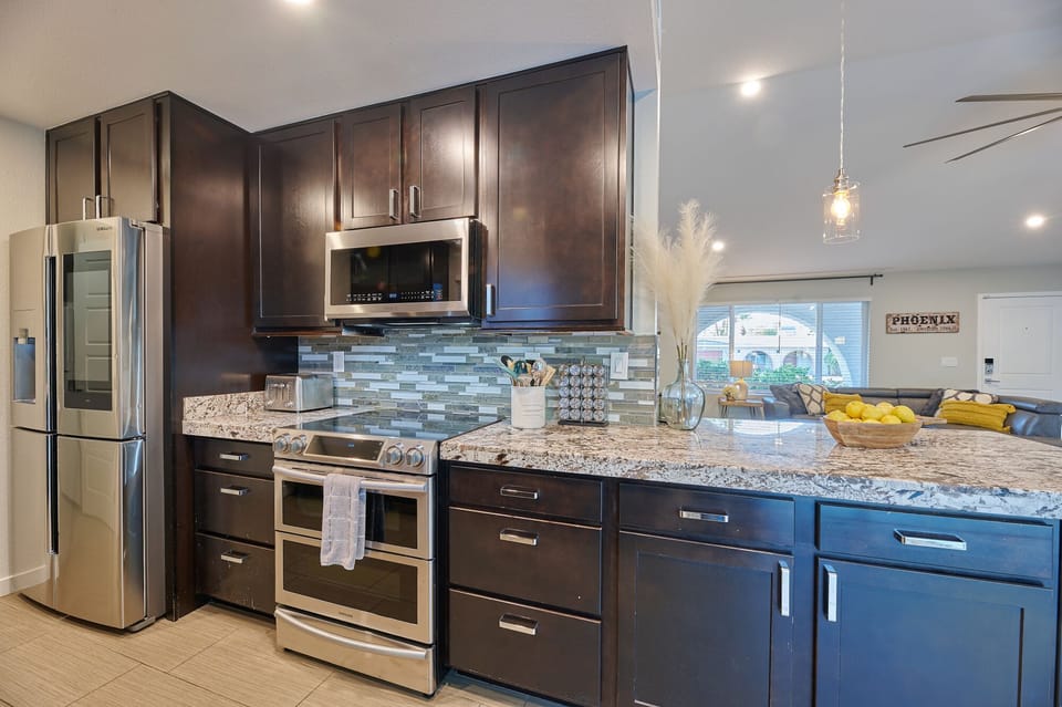 Fully stocked kitchen with smart fridge, toaster, oven/microwave, spices, etc.