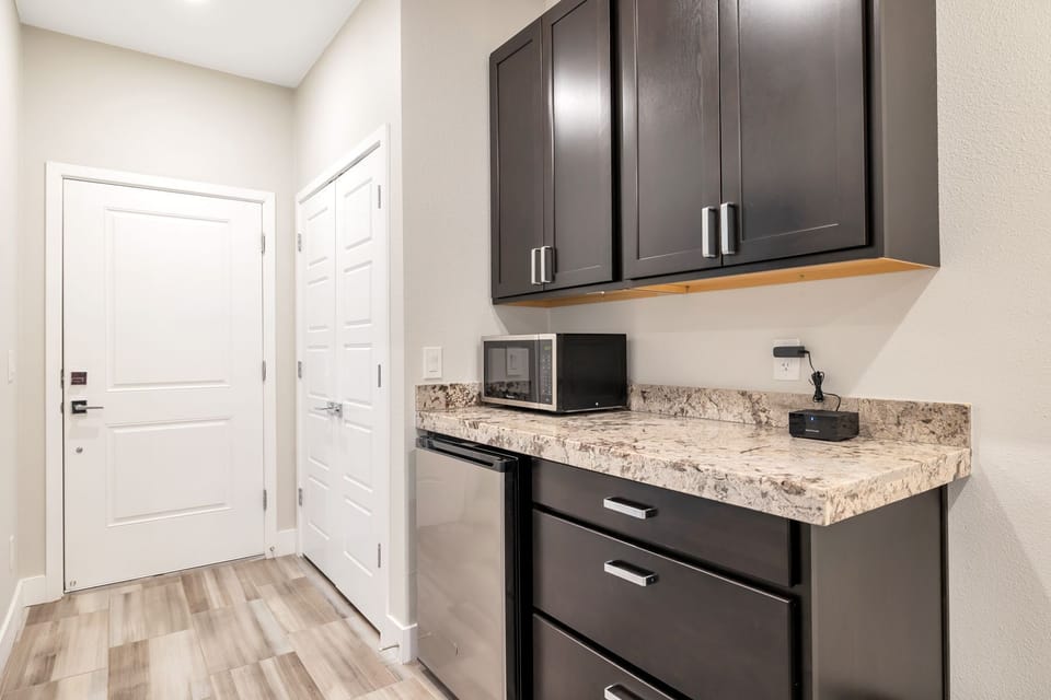 Casita kitchenette with small fridge and microwave.