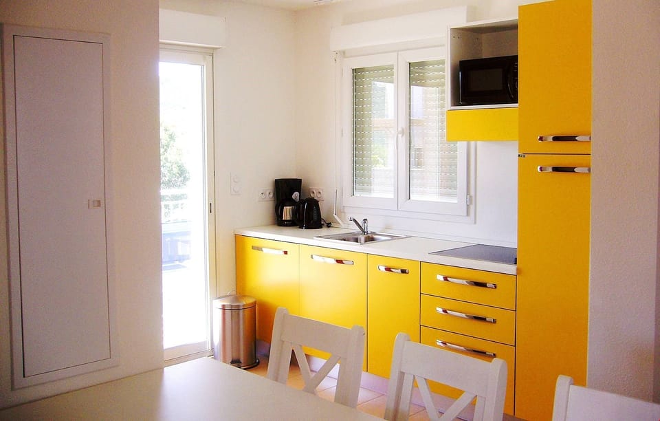 Prepare meals in the kitchen and enjoy them together at the dining table.