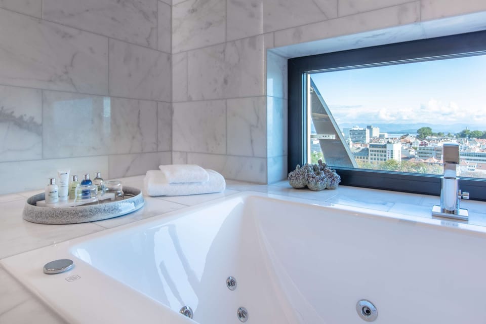 Eco-friendly toiletries, hair dryer, heated floors, towels