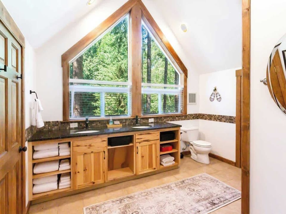 Enjoy getting ready with a view of the trees surrounding the home. 