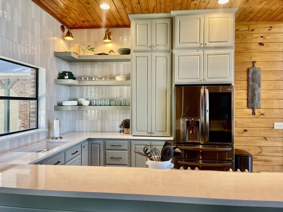 Recently remodeled kitchen featuring quartz countertops and new appliances. 