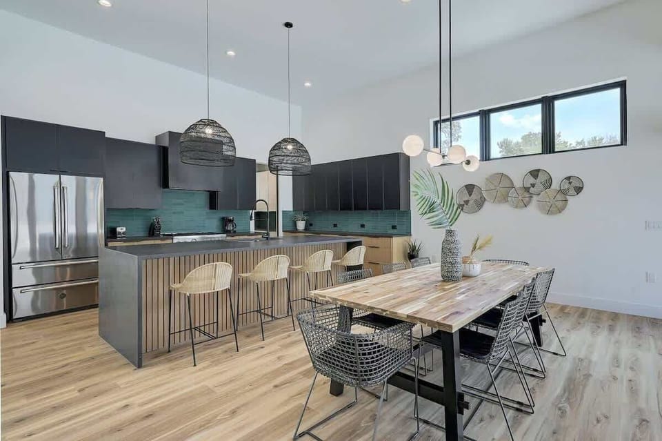 There is seating for 4 at the breakfast bar and seating for 8 at the dining table
