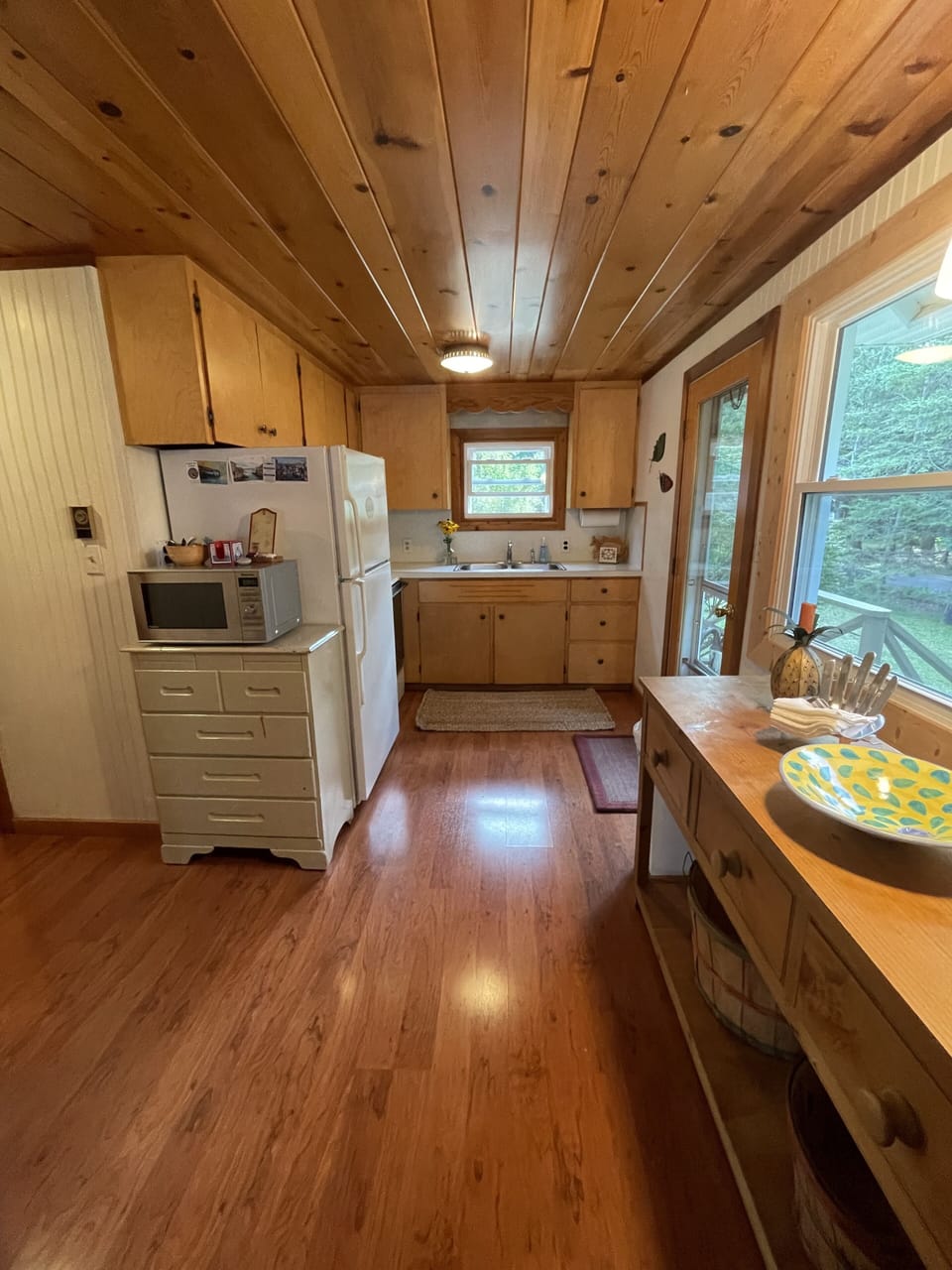 Kitchen with microwave, oven & fridge  