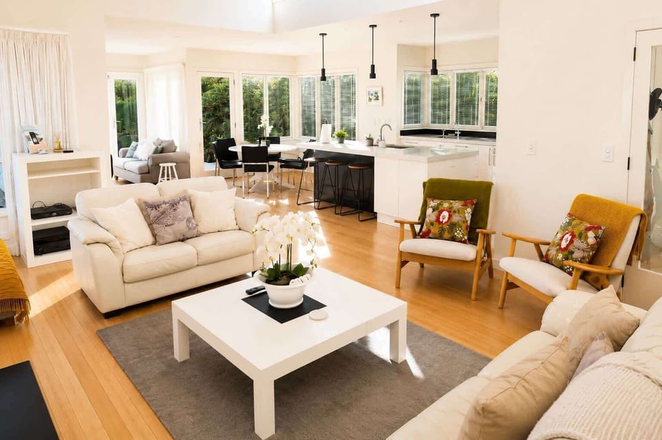 Open plan living room with lake and mountain views 