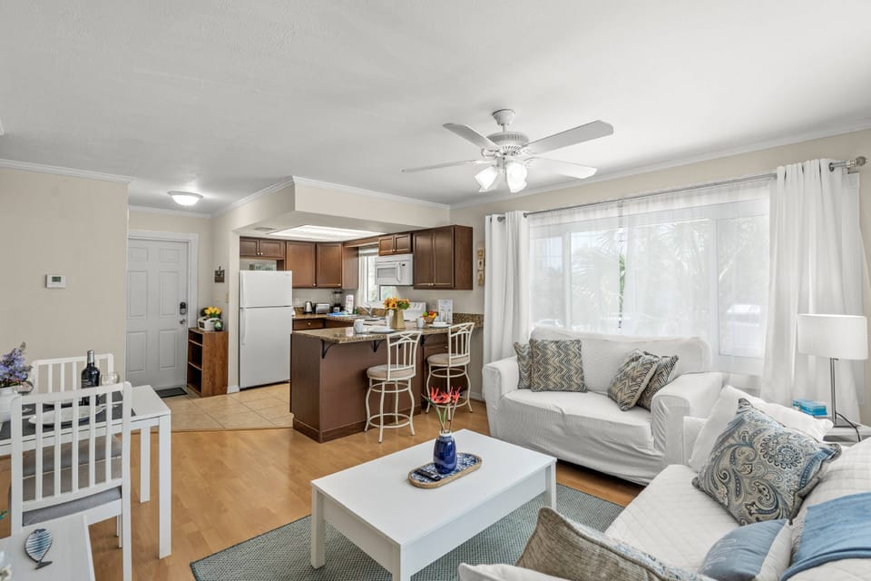 Smartly designed for comfort and flow, this open-concept area features a cozy living space, practical kitchenette, and casual dining nook all in one.