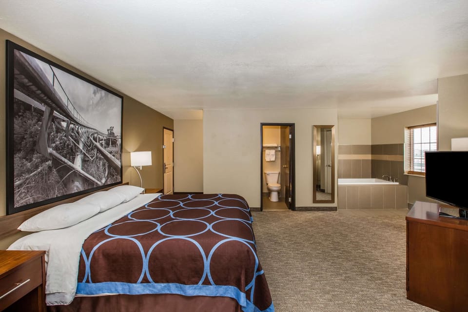 Suite, 1 King Bed, Non Smoking | 1 bedroom, desk, blackout drapes, iron/ironing board