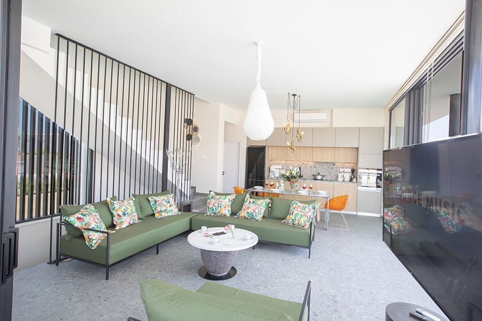 Living room with sofas, coffee table and Smart TV