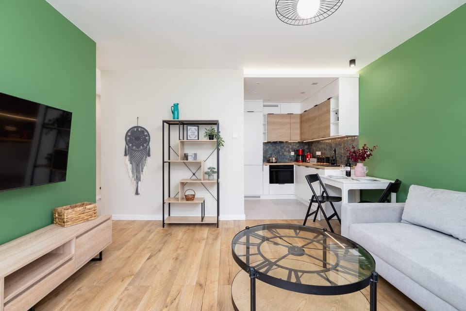 Another view of the living room showcasing its spacious layout and connection to the dining area.
