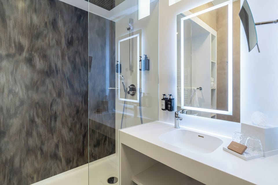 Shower, free toiletries, hair dryer, bathrobes