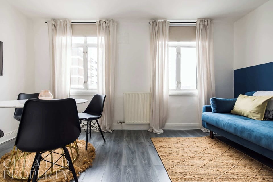 Living area and open plan kitchen/dining table