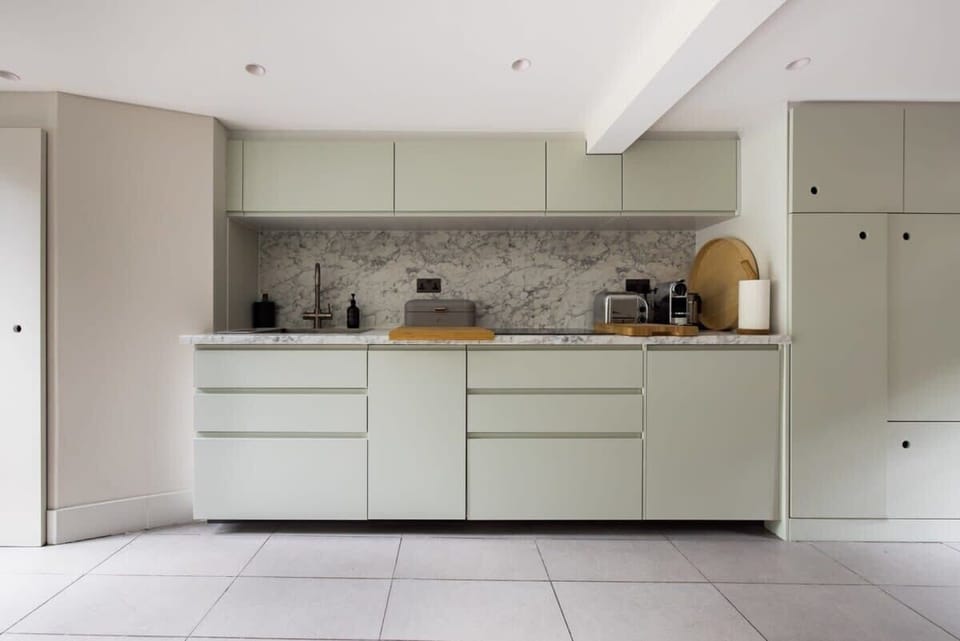 Islington Townhouse contemporary kitchen featuring a marble countertop
