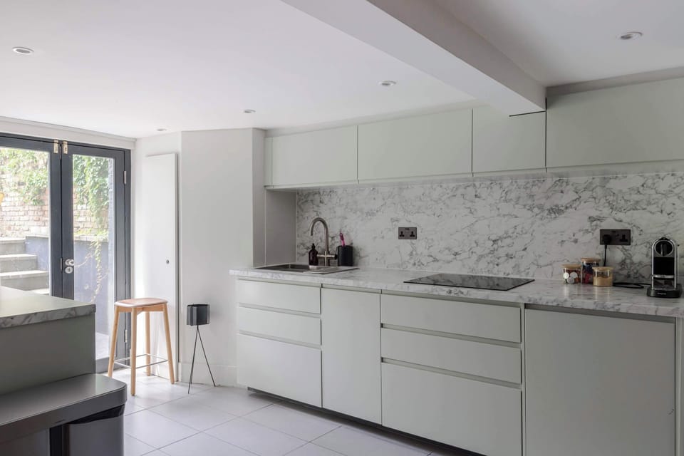 Islington Townhouse contemporary kitchen featuring a marble countertop
