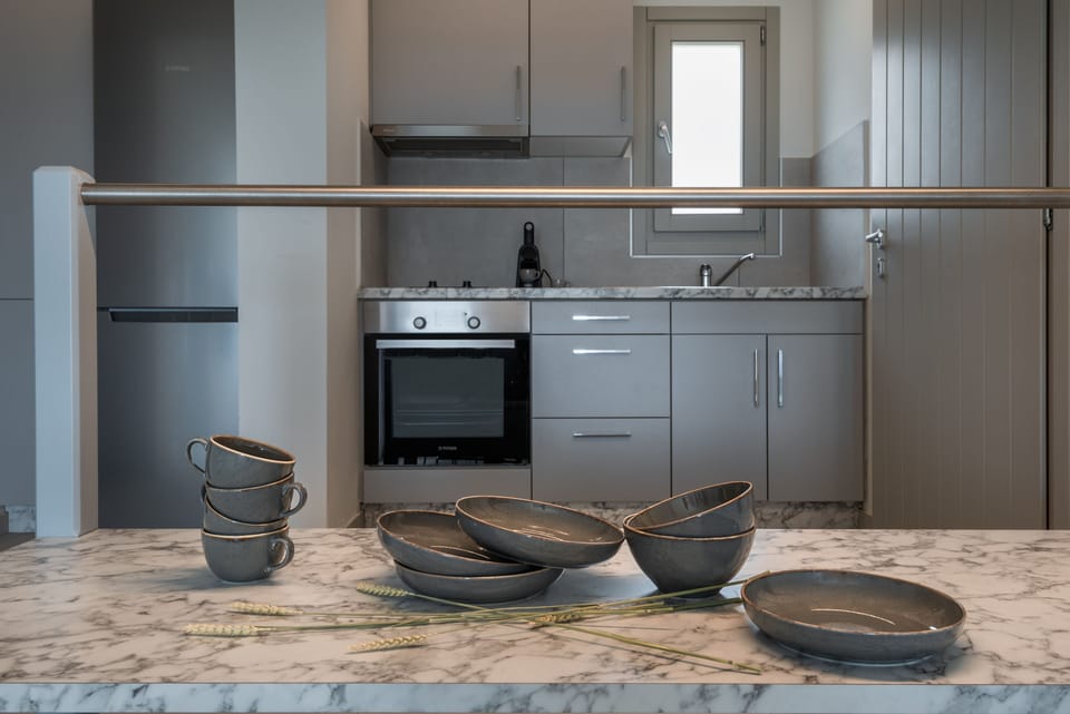 Deluxe Apartment | Private kitchen | Full-size fridge, oven, stovetop, espresso maker