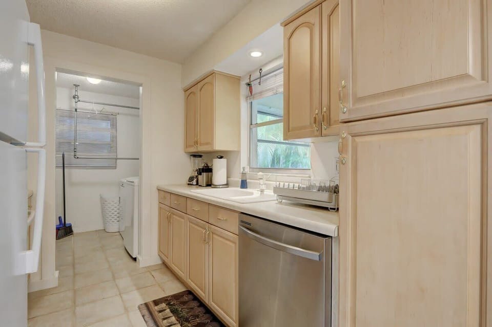 The Kitchen is a Galley Style With Views to the Sunroom