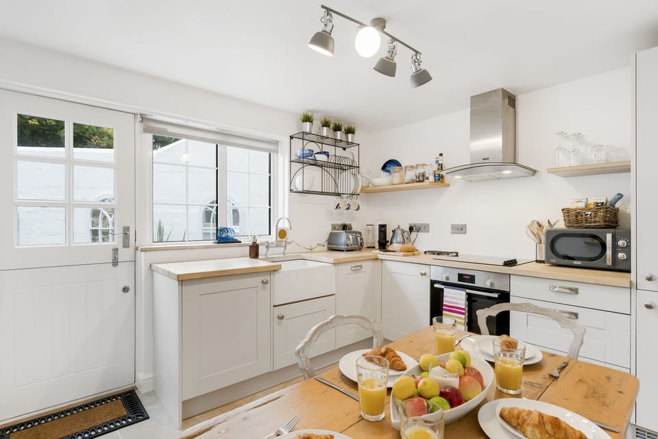 Jade Cottage, St Agnes. Ground floor: Kitchen leads out into the secluded and enclosed patio garden