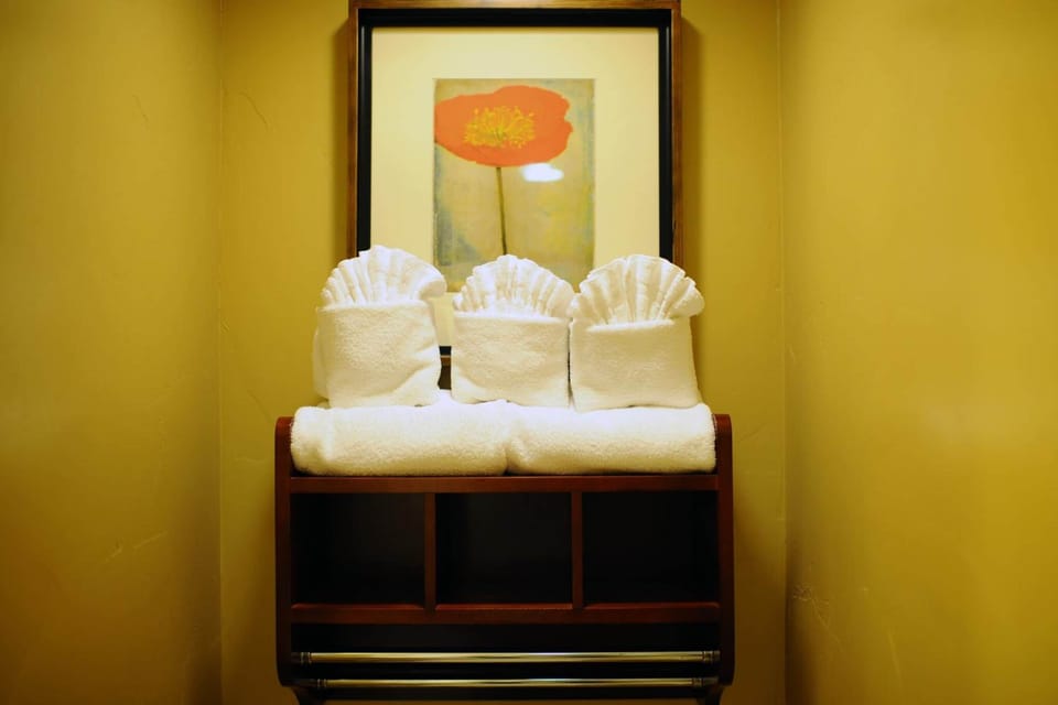 Suite, 1 King Bed | Bathroom | Designer toiletries, hair dryer, towels