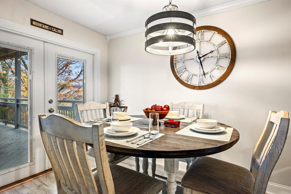 Dining room table with adjacent breakfast bar for dining up to 7 guests.