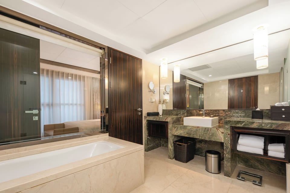 Executive Suite | Bathroom | Hair dryer, bathrobes, slippers, towels