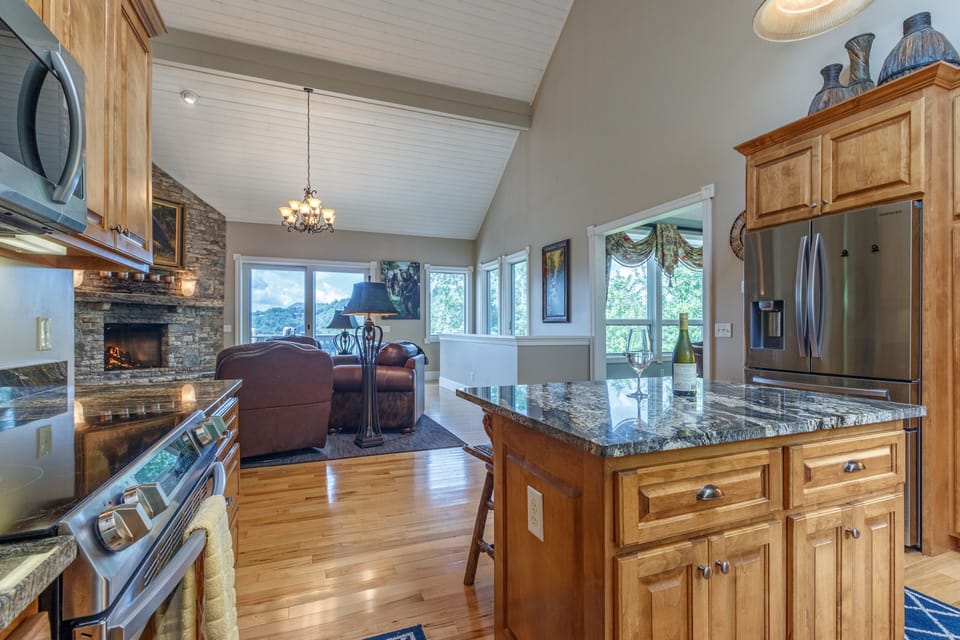 View of Lake Glenville and the mountains to be seen through the open floorplan