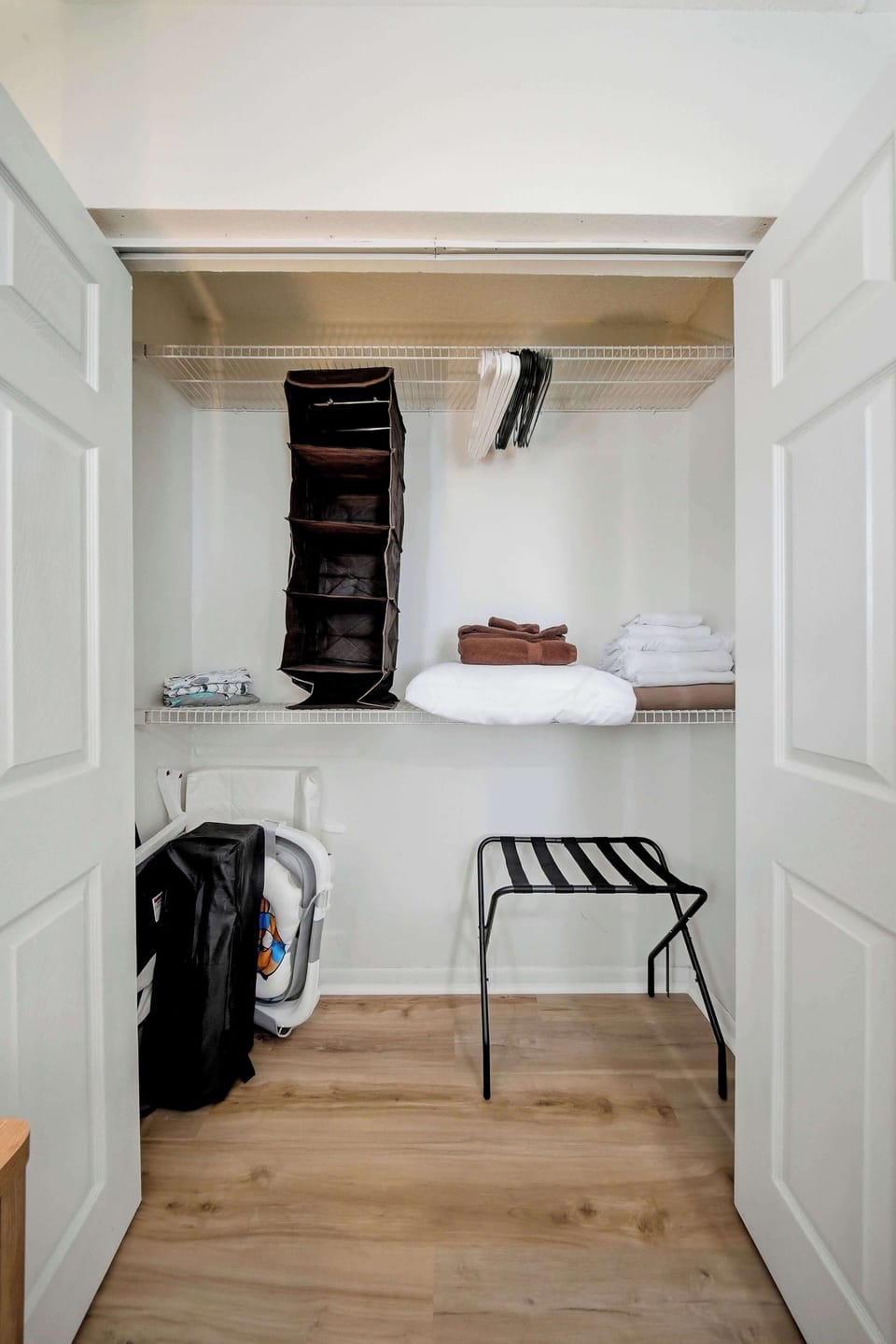 Unpack and settle in. Our spacious closet offers hanging organizers, a luggage rack, extra linens, and a Pack 'n Play for the little ones!