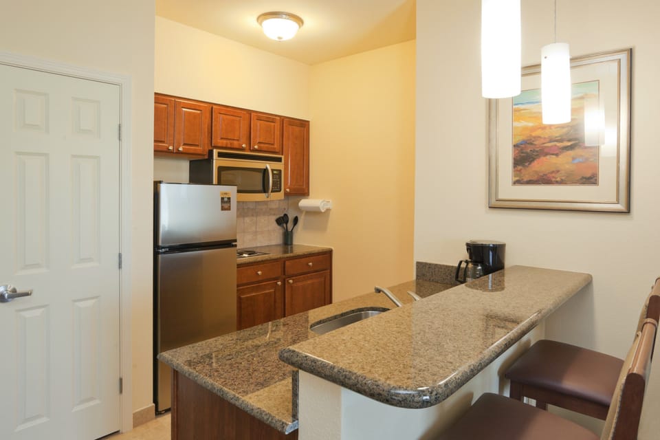Curb your appetite by cooking a meal in your kitchen.