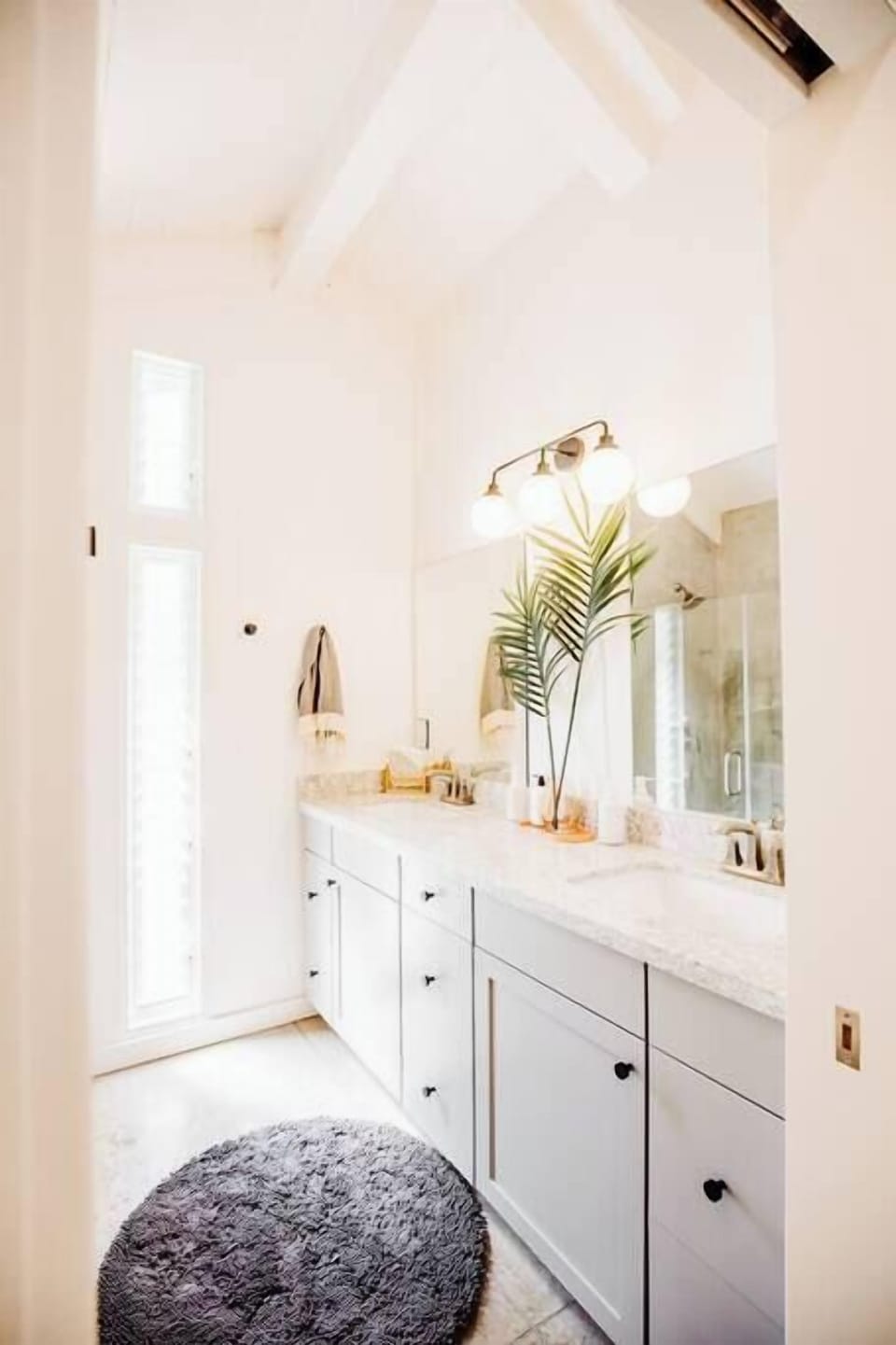 Master Suite 1 bathroom with double , body lotion, cotton balls, face mirror, hairdryer