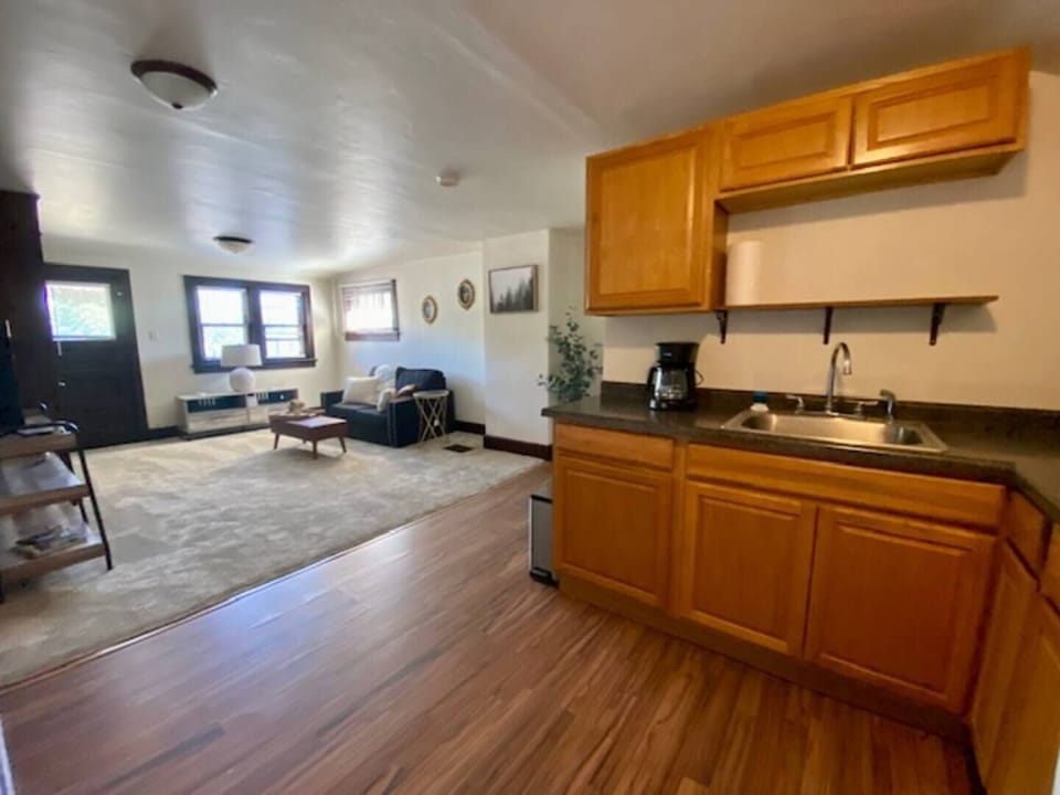 View of the kitchen and living room areas.