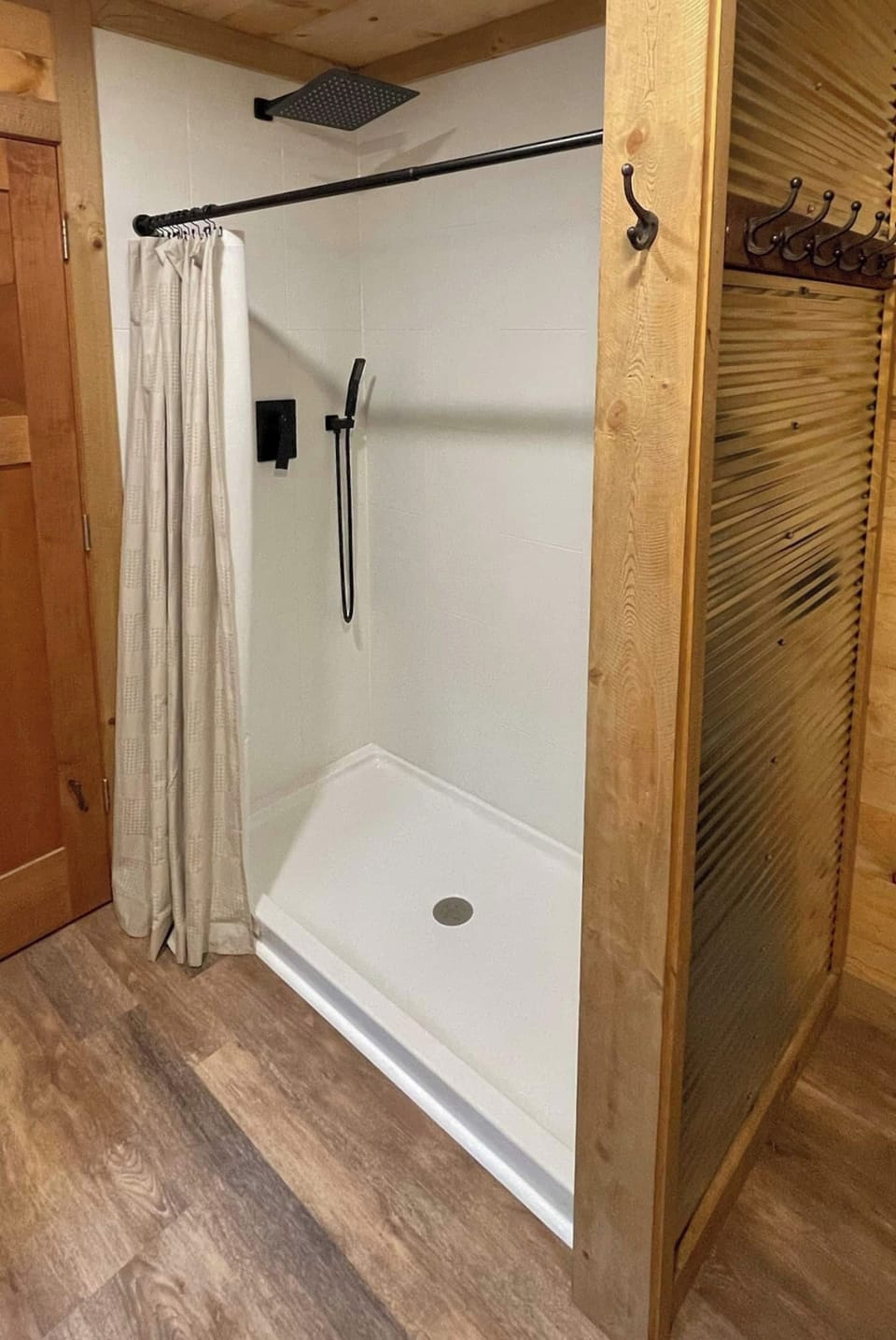 Large walk-in shower with rainshower shower head.