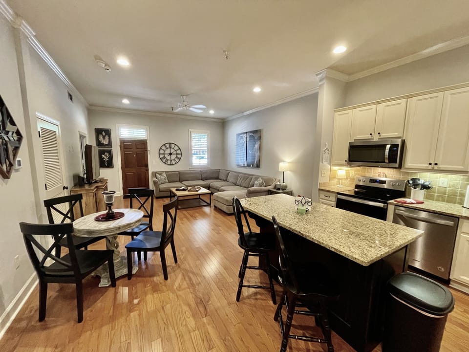 Living Area - The living area of BamaNati is an open concept floor plan so whether you're cooking in the kitchen, eating at the dining table, or watching Alabama Football on the couch, you'll be connected with everyone.