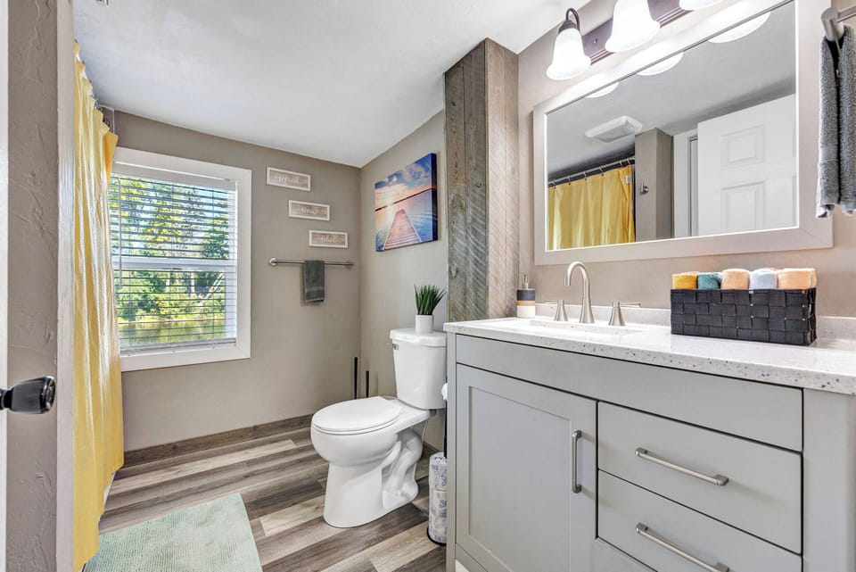 Bathroom #1 - with tub & shower combo. Located off of living room.