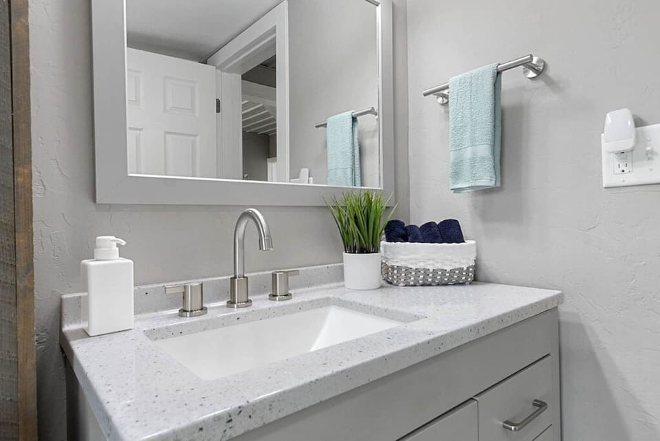 Bathroom #1 - with tub & shower combo. Located off of living room.