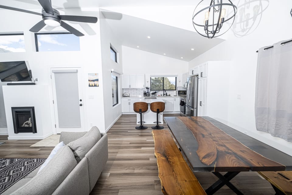 A Large custom wood and resin dining table has space for the whole group!