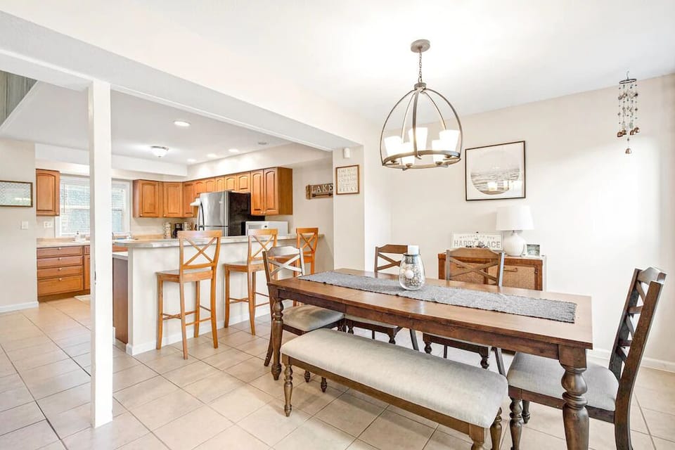 Nice dining table upstairs with 3 barstools for extra seating.