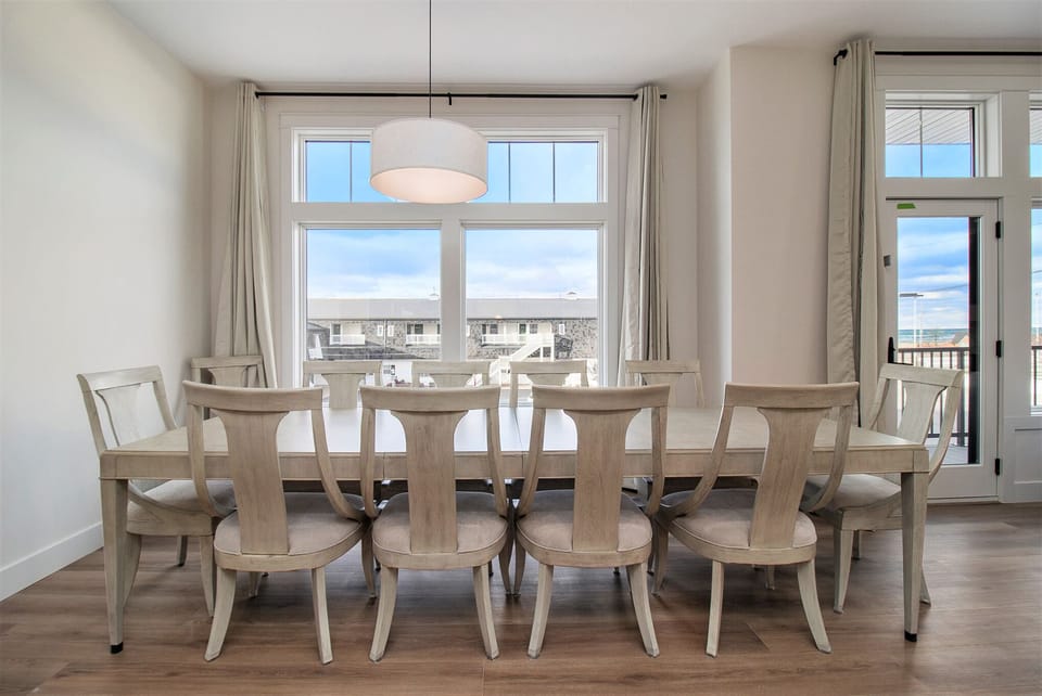 2nd floor dining room table and 12 chairs.