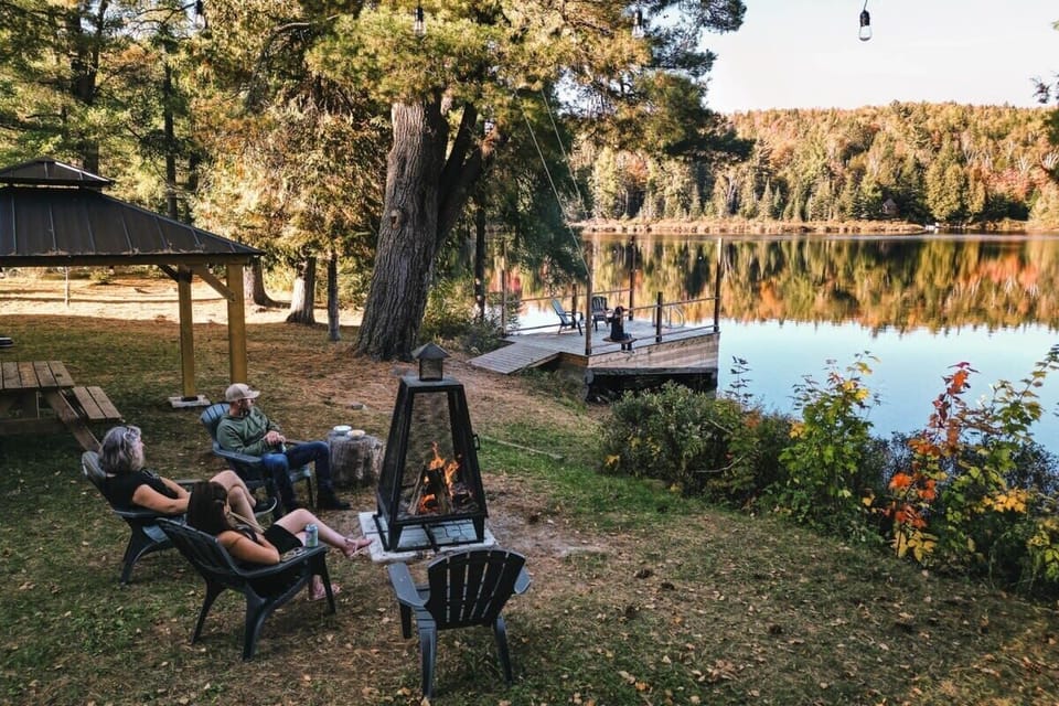 Gather lakeside, flames dancing, autumn hues. Your serene escape.