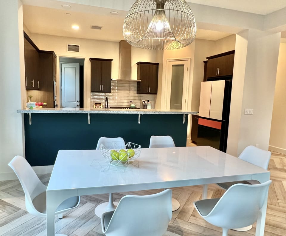 Dining area with CB2 table sits 6 people. 