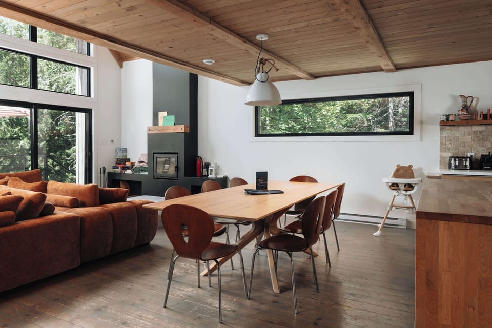Experience open living, forest views, and fireside moments. 