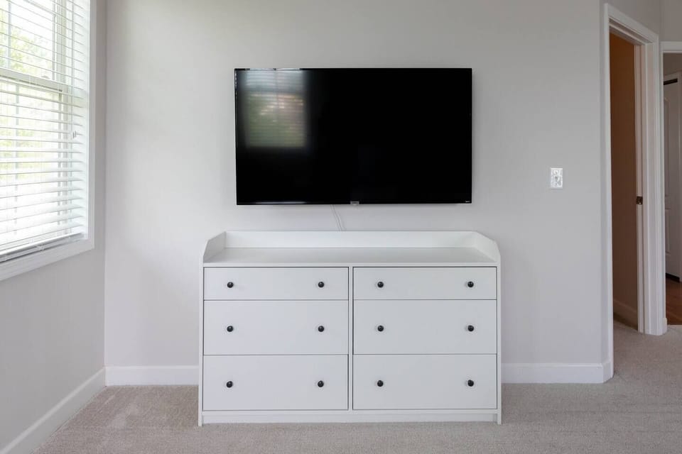 Master bedroom includes 55 inch smart Roku TV 