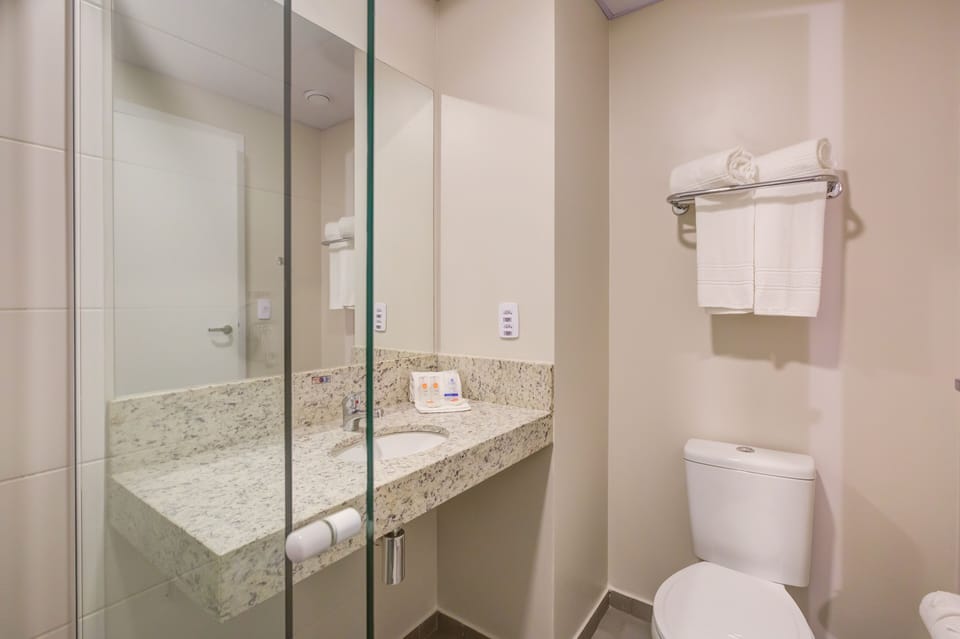 Shower, rainfall showerhead, towels, soap
