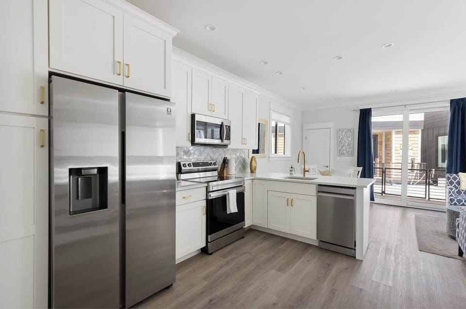 Full kitchen, stocked with everything you need to prepare and eat a meal. 