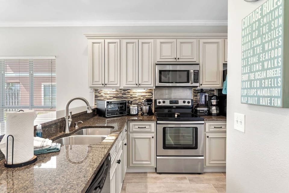 Kitchen is fully equipped with appliances and kitchen stuff!