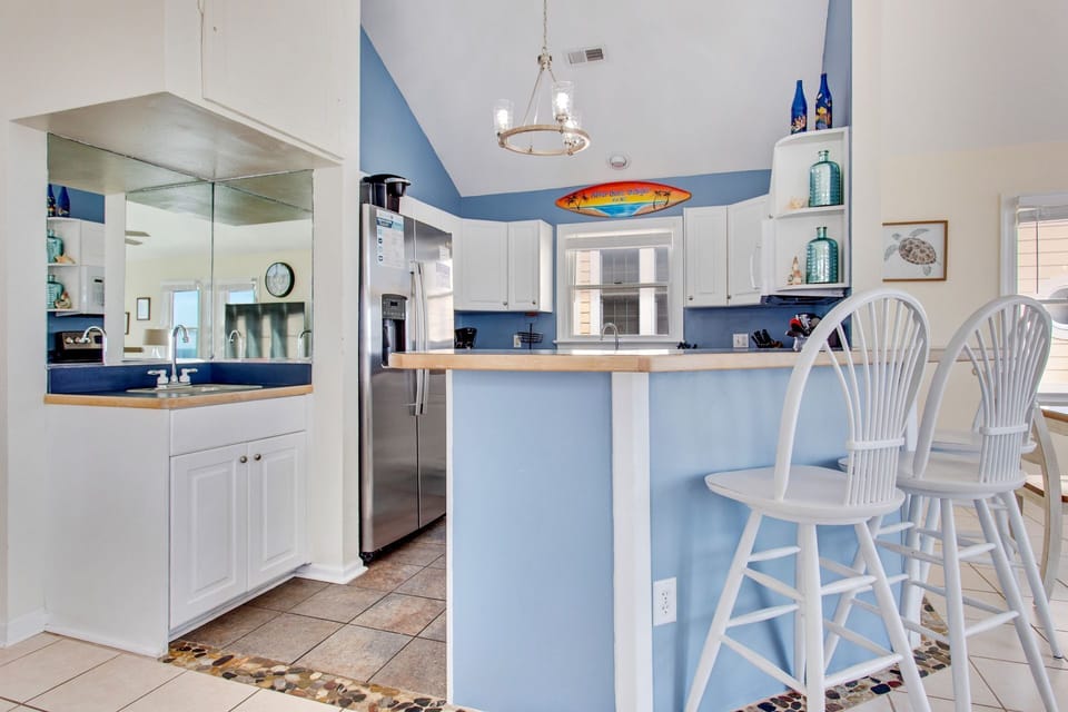 Whip up something delicious in the Modern Kitchen with stainless steel appliances.
