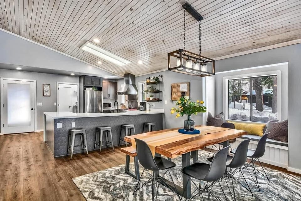 Plenty of space for larger groups to enjoy meals together, with 8 seats at wood slab dining table, and 4 additional breakfast bar stools. 

Kitchen fully equipped with cookware, bakeware, and dinnerware.