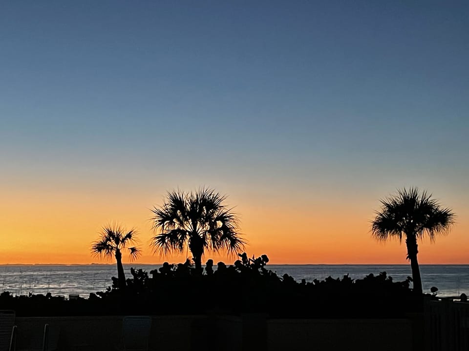View from beachfront pool at sunset!