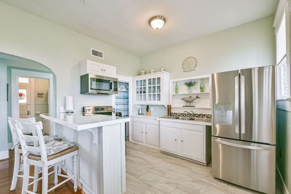 The kitchen boasts stainless steel appliances