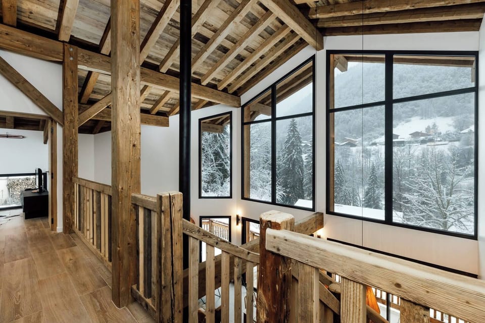 Entrance to the chalet with ski room, TV room, and staircase to the first ground floor
