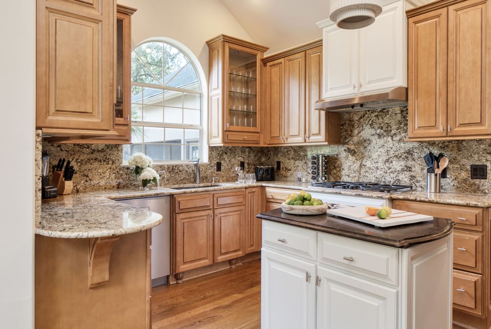 Spacious kitchen with convenient grocery shopping ten minutes away.