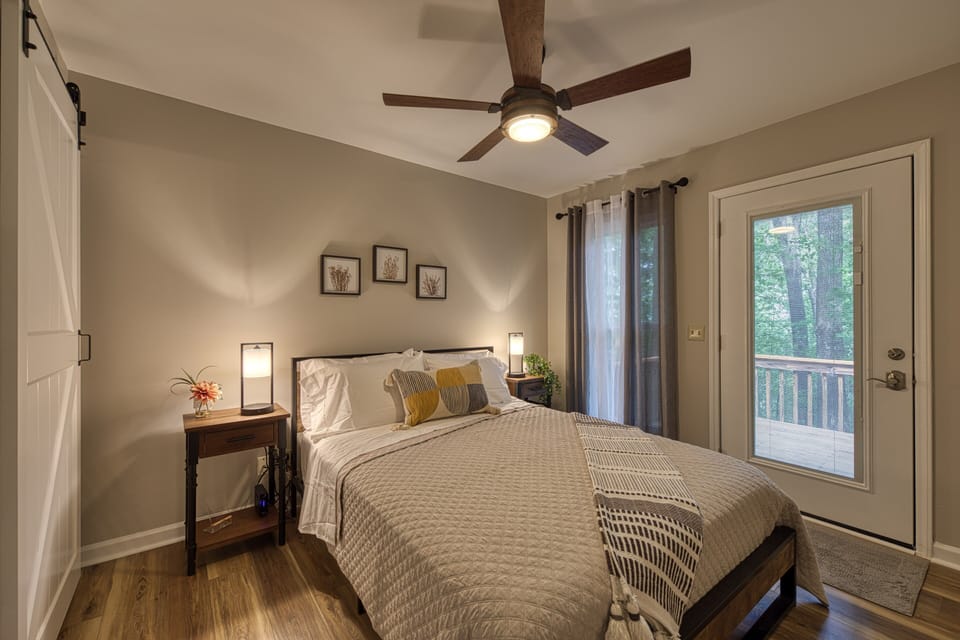 Brand new Queen-sized bed with excellent direct access to the wrap-around deck.